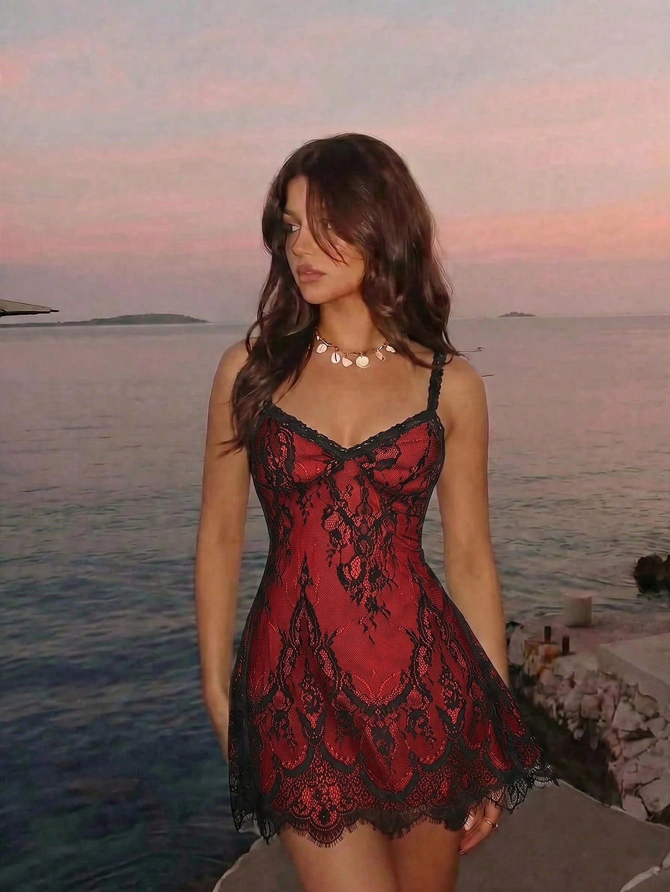 Women's short lace cami dress with spaghetti straps, contrast lace detailing, high waist, slim fit, and straight hem.