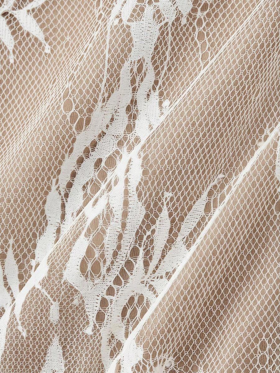Women's short lace cami dress with spaghetti straps, contrast lace detailing, high waist, slim fit, and straight hem.