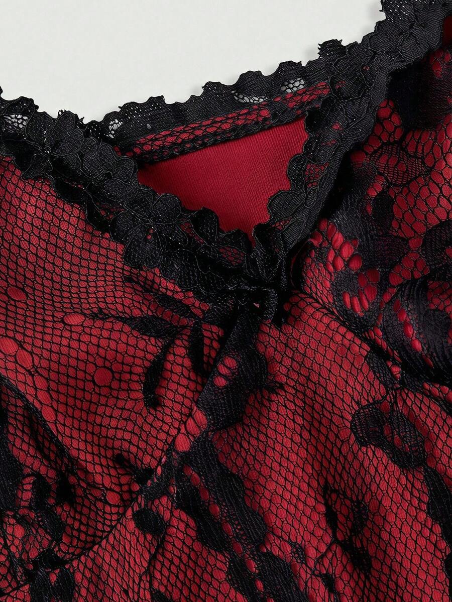 Women's short lace cami dress with spaghetti straps, contrast lace detailing, high waist, slim fit, and straight hem.