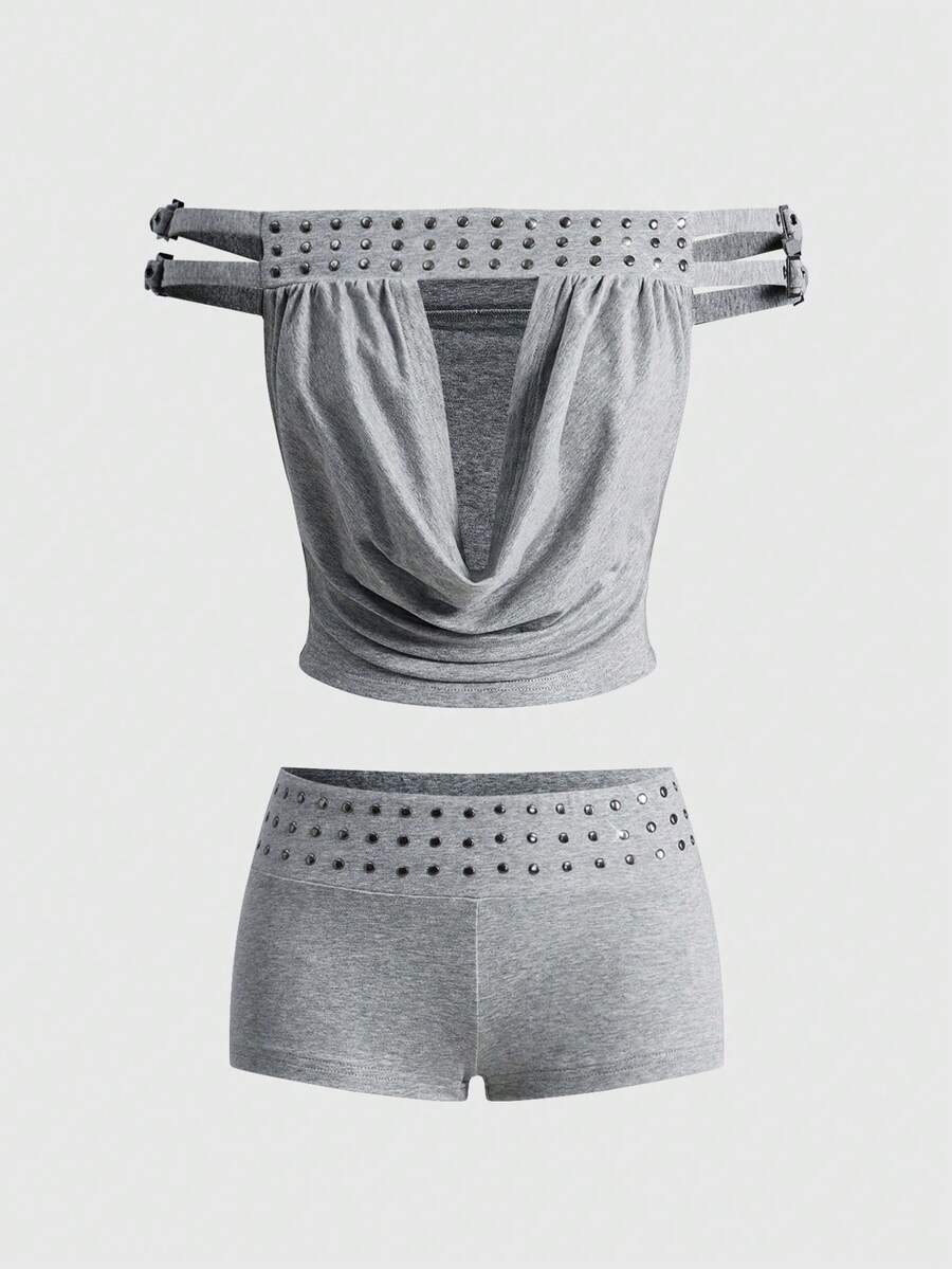 Women's grey Y2K two-piece set featuring an off-the-shoulder crop top with studded details and matching mini shorts.
