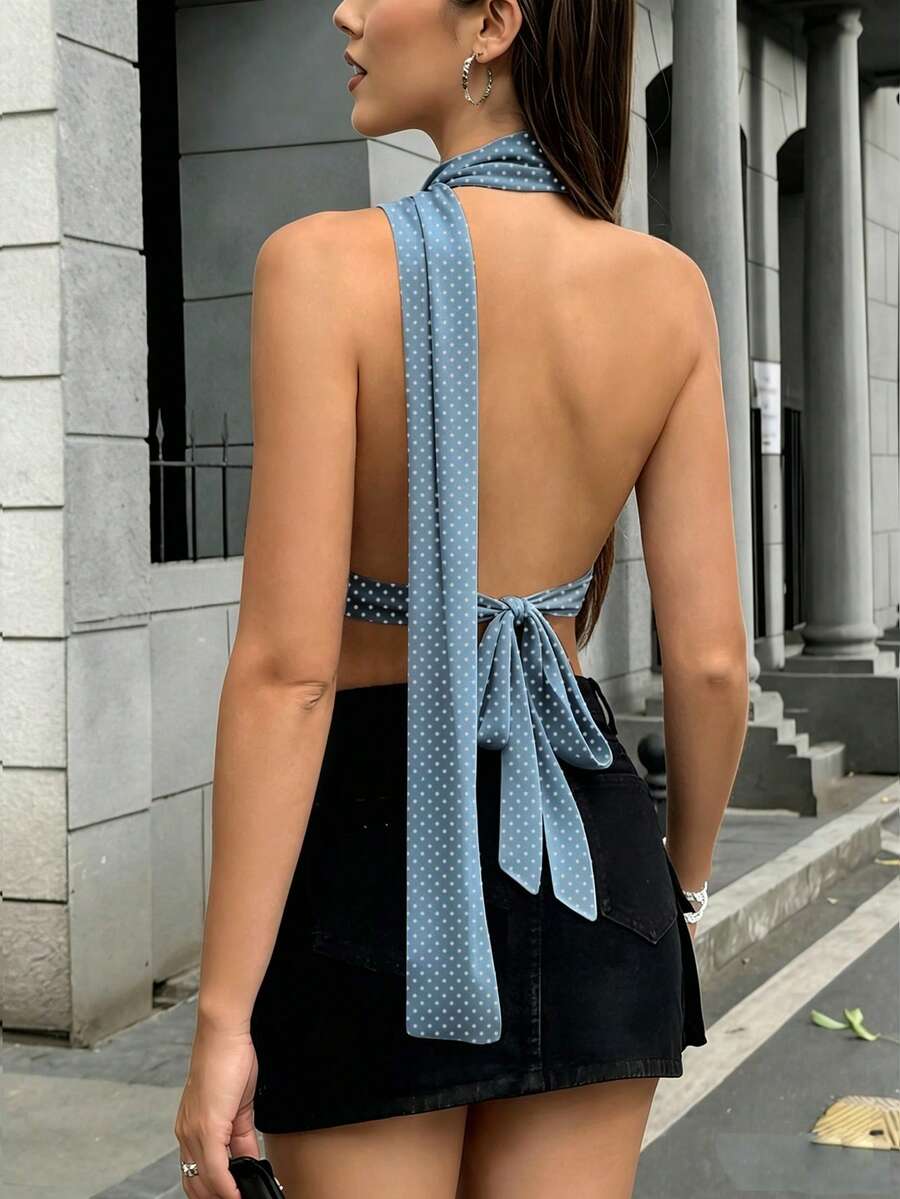Women's polka dot halter tank top featuring neck straps, a backless tie-back design, regular hem, loose fit, and woven polyester fabric.