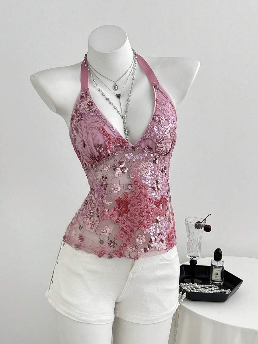 Pink sheer lace tie-up halter crop top featuring floral sequin patchwork, deep V-neck, and backless tie-back design.