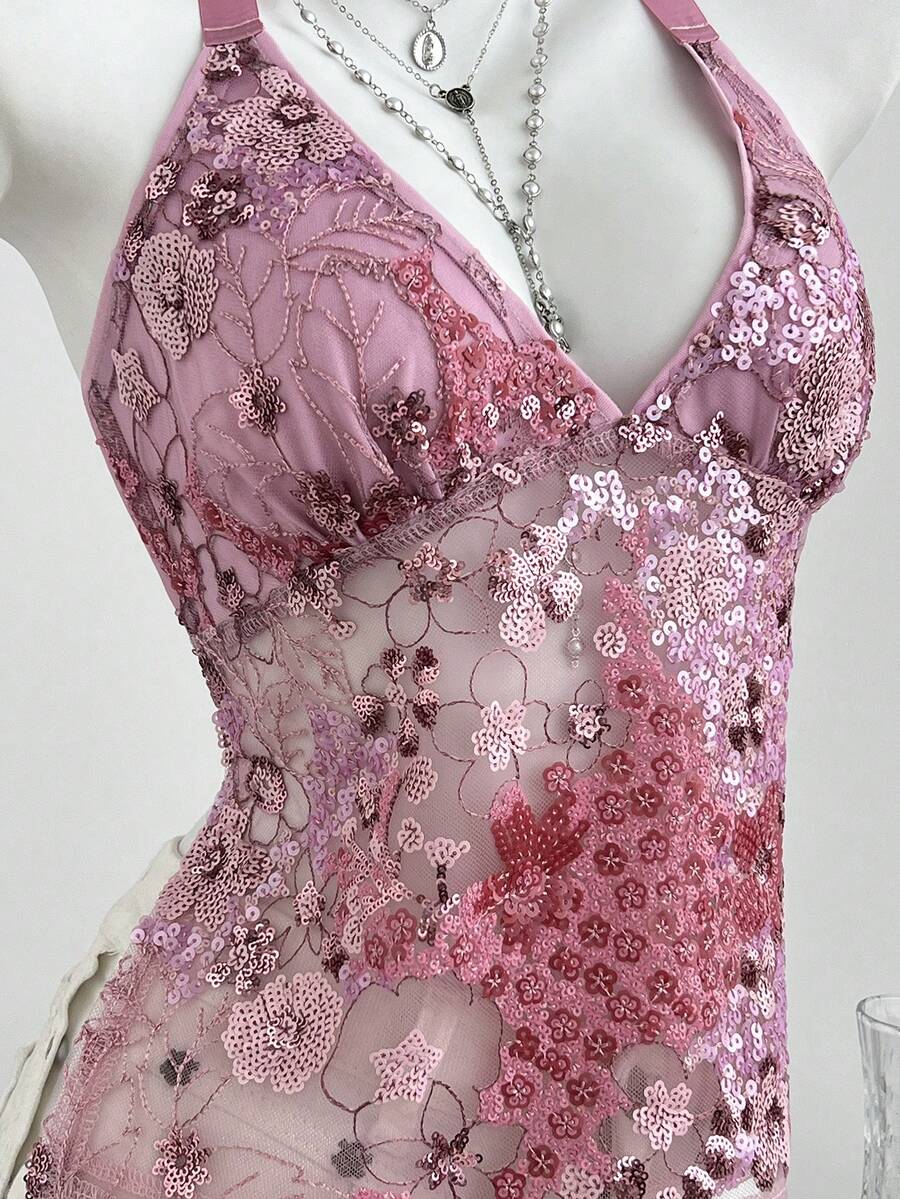 Pink sheer lace tie-up halter crop top featuring floral sequin patchwork, deep V-neck, and backless tie-back design.