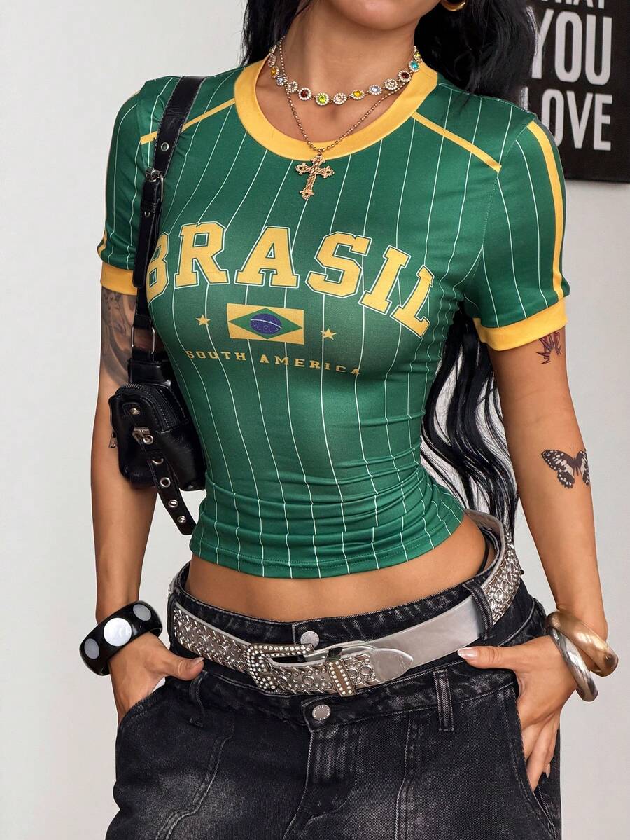 Women's short-sleeve slim fit knit jersey t-shirt featuring a round neck, letter embroidery, and contrast rib-knit trim.