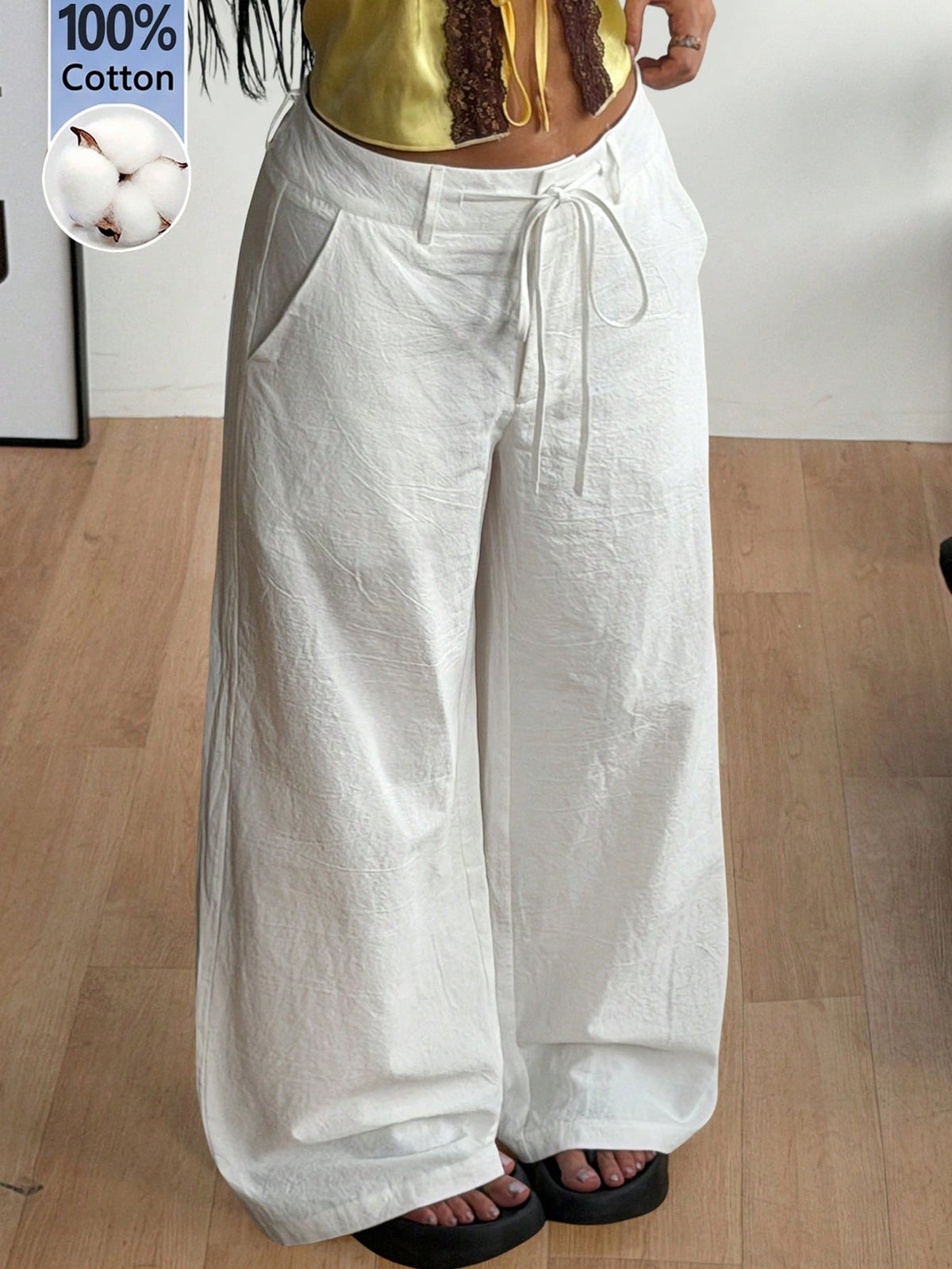 Women's casual straight leg striped woven pants featuring a low waist and zipper fly closure.
