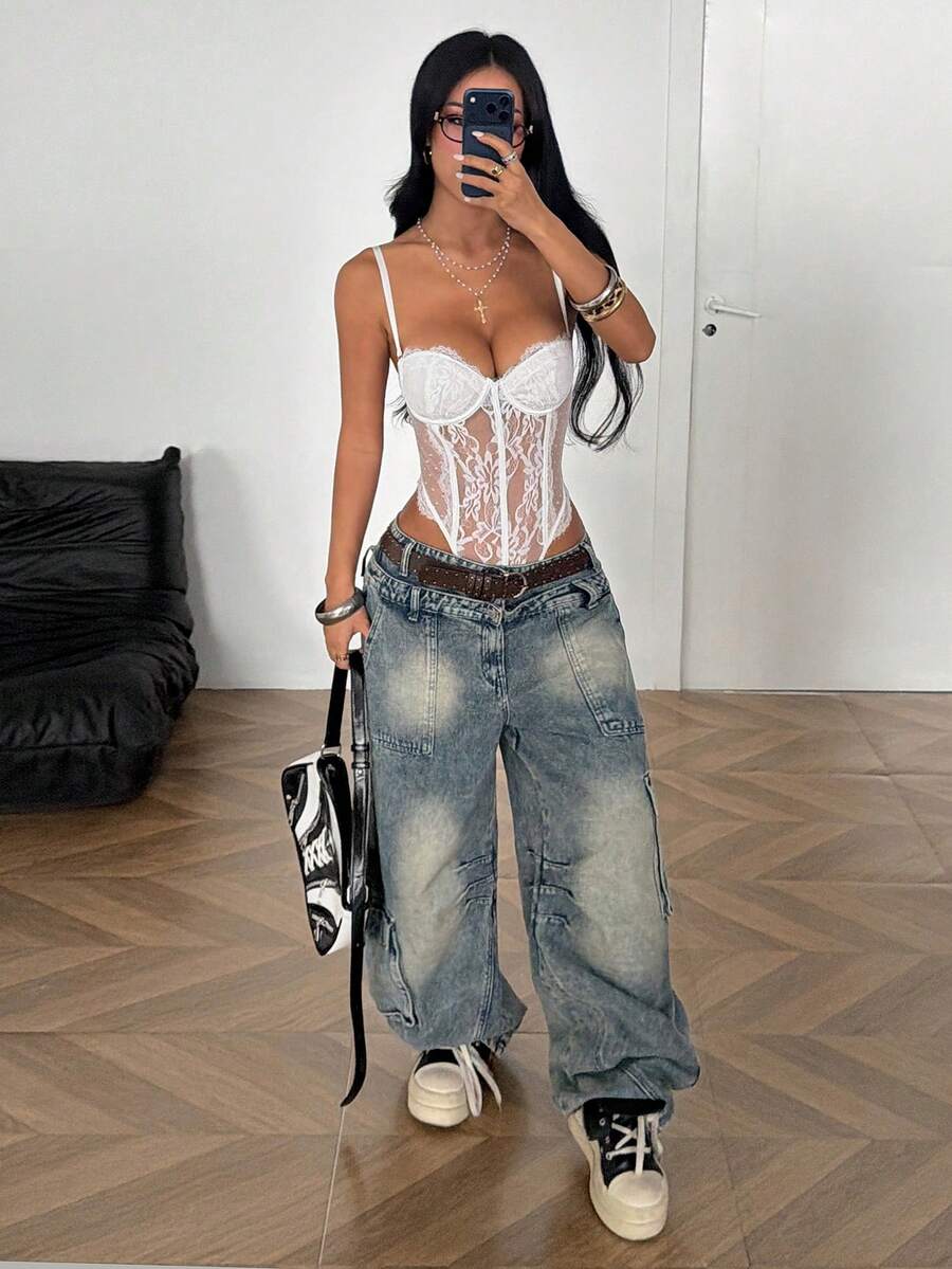 Fitted women's lace and mesh cami bodysuit with spaghetti straps.