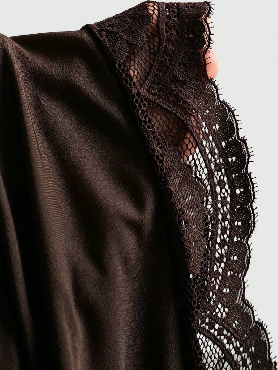 Women's short cami dress with cowl neck, spaghetti straps, contrast lace patchwork, pleated detail, and asymmetrical hem