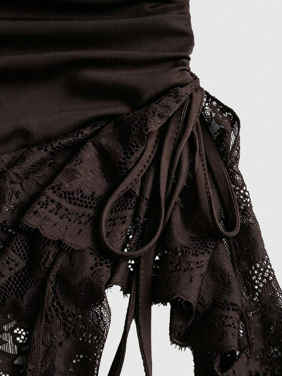 Women's short cami dress with cowl neck, spaghetti straps, contrast lace patchwork, pleated detail, and asymmetrical hem