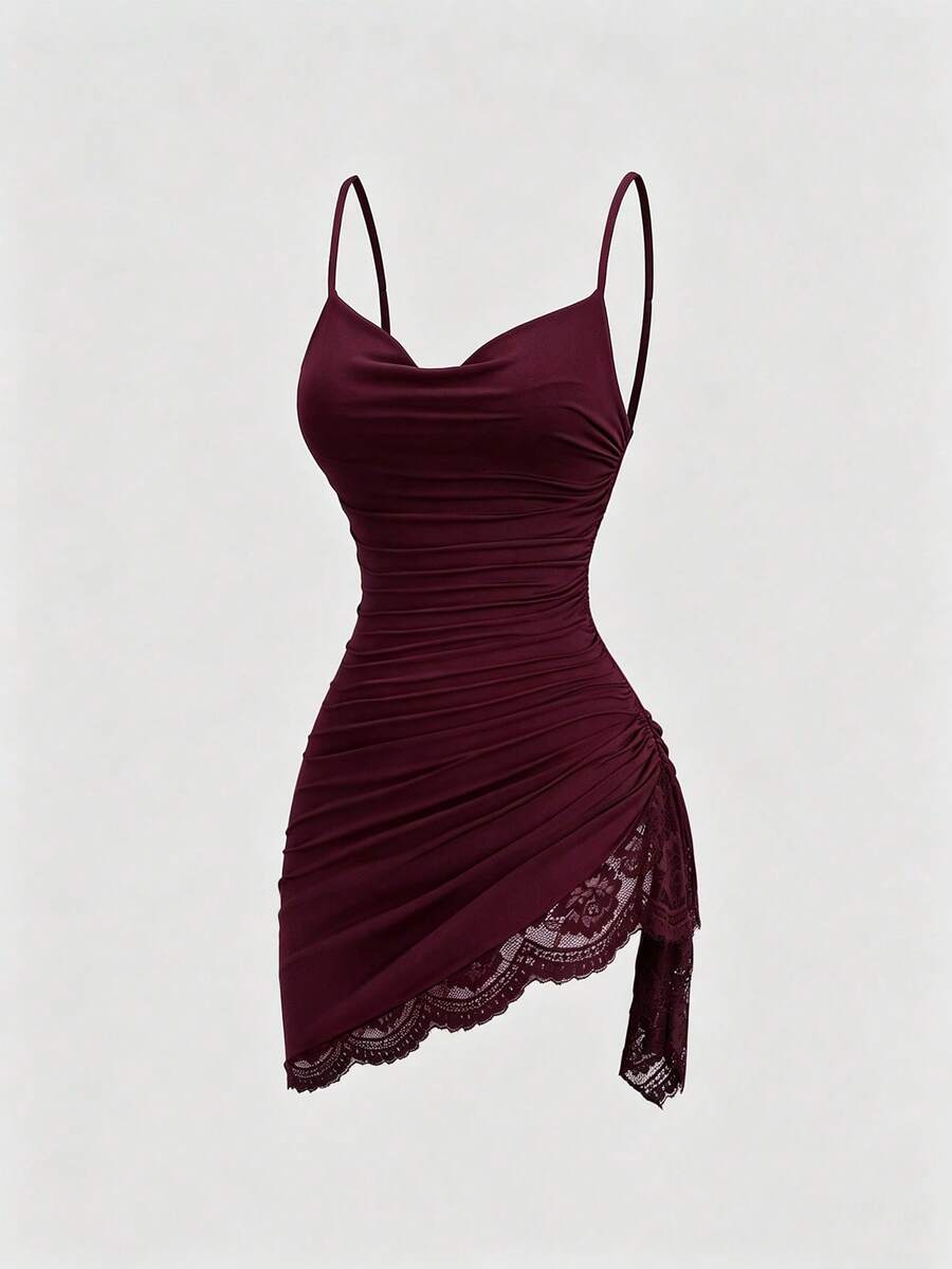 Women's short cami dress with cowl neck, spaghetti straps, contrast lace patchwork, pleated detail, and asymmetrical hem