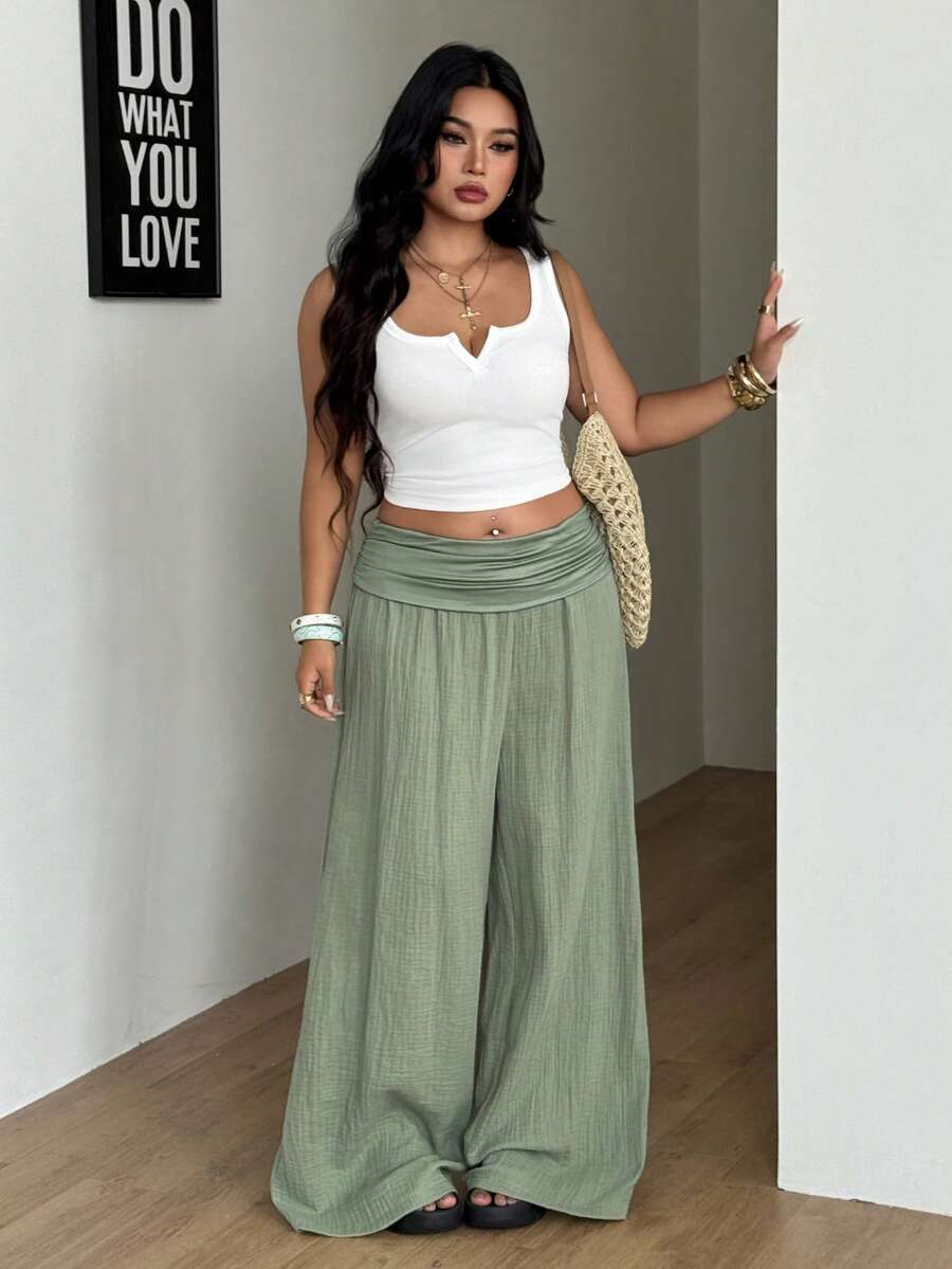 Women's plus size wide leg cotton pants featuring a relaxed loose fit and high waist design.