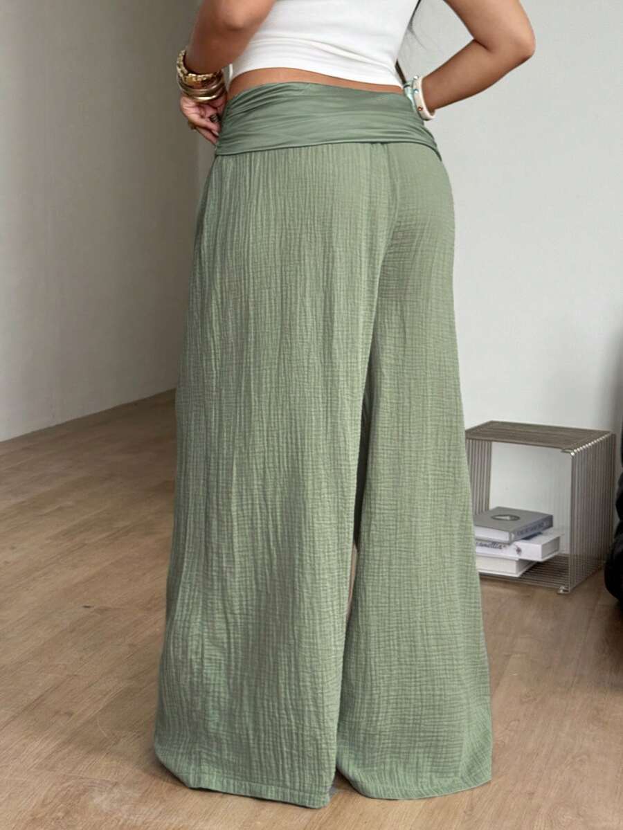 Women's plus size wide leg cotton pants featuring a relaxed loose fit and high waist design.