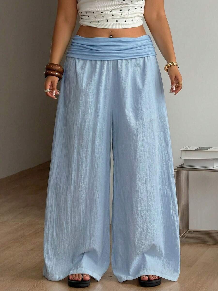 Women's plus size wide leg cotton pants featuring a relaxed loose fit and high waist design.