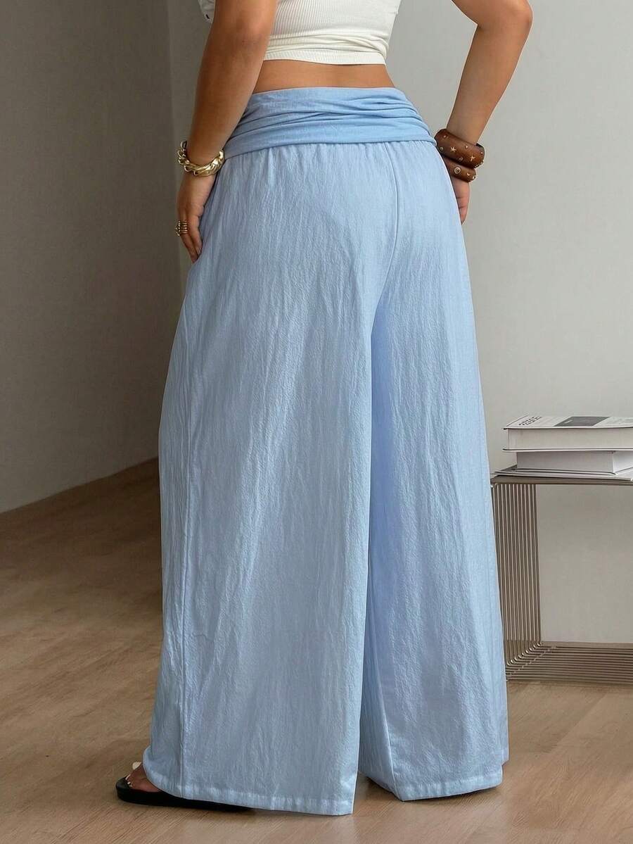 Women's plus size wide leg cotton pants featuring a relaxed loose fit and high waist design.