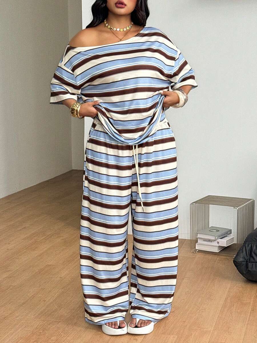 Striped two-piece casual outfit featuring an asymmetrical off-shoulder short-sleeve top and matching loose wide-leg pants with side pockets.