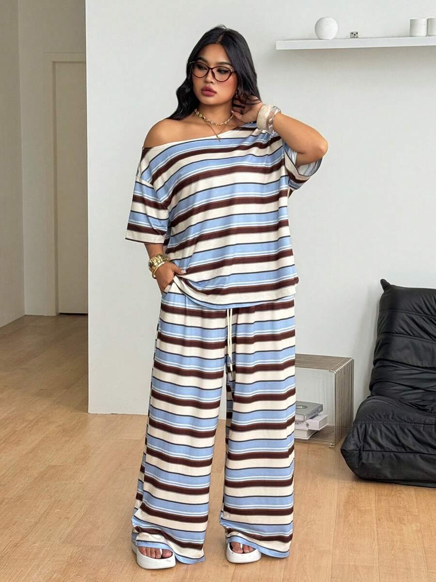 Striped two-piece casual outfit featuring an asymmetrical off-shoulder short-sleeve top and matching loose wide-leg pants with side pockets.