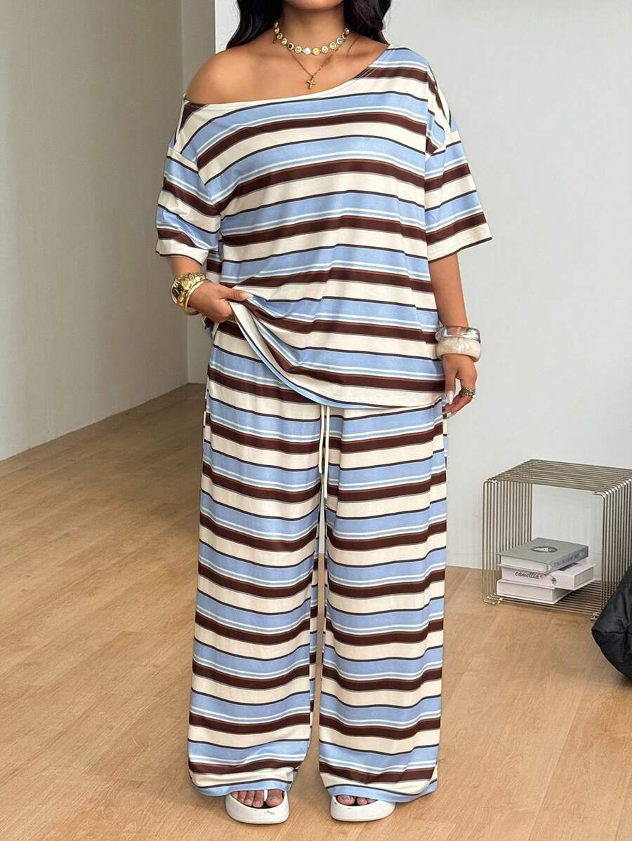 Striped two-piece casual outfit featuring an asymmetrical off-shoulder short-sleeve top and matching loose wide-leg pants with side pockets.