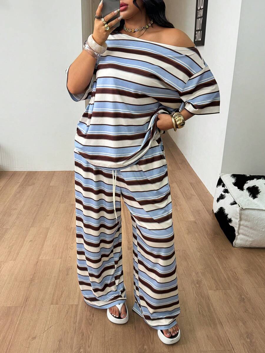 Striped two-piece casual outfit featuring an asymmetrical off-shoulder short-sleeve top and matching loose wide-leg pants with side pockets.