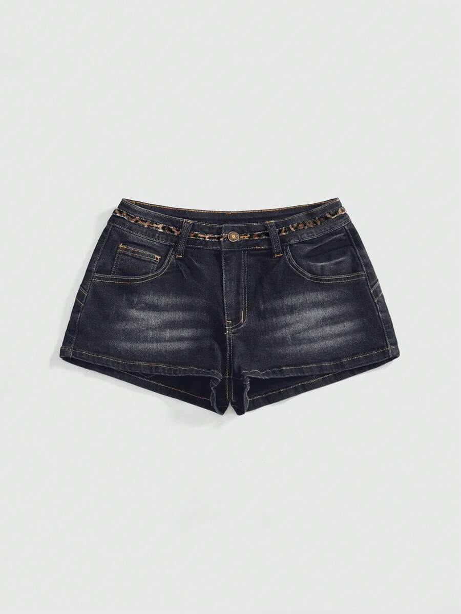 Women's super low waist shorts with leopard print embroidery, button and zipper closure, and raw hem detailing.