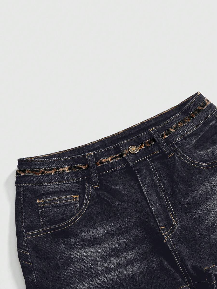 Women's super low waist shorts with leopard print embroidery, button and zipper closure, and raw hem detailing.