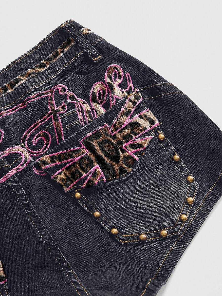 Women's super low waist shorts with leopard print embroidery, button and zipper closure, and raw hem detailing.
