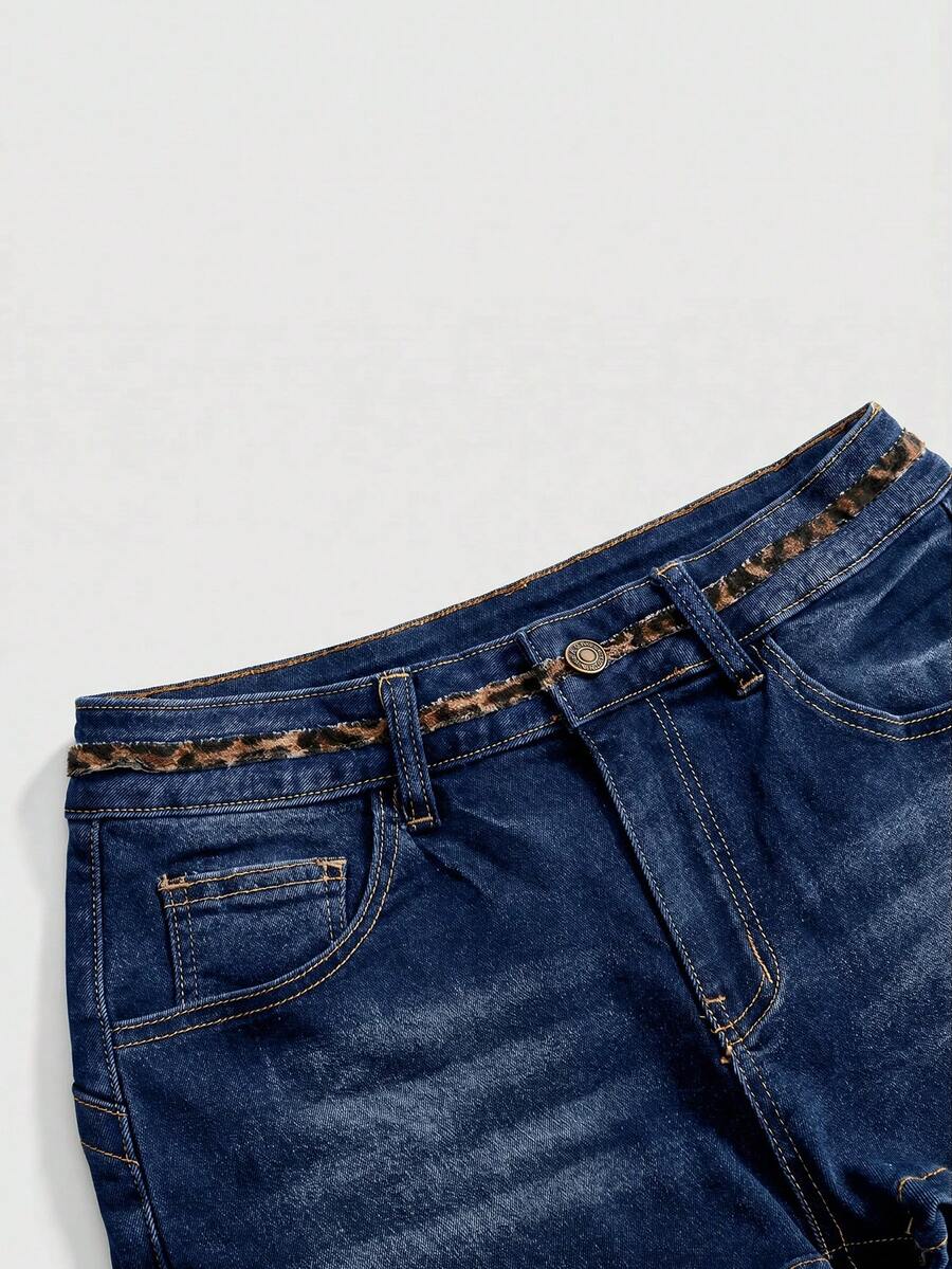 Women's super low waist shorts with leopard print embroidery, button and zipper closure, and raw hem detailing.