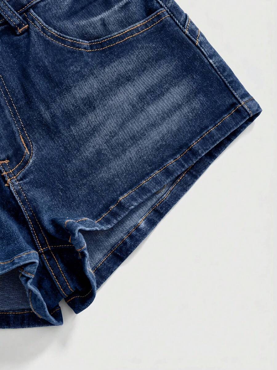 Women's super low waist shorts with leopard print embroidery, button and zipper closure, and raw hem detailing.