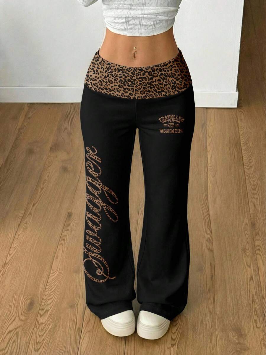 Women's black leopard print flare leg sweatpants with an elastic mid waist crafted from cotton knitted fabric.