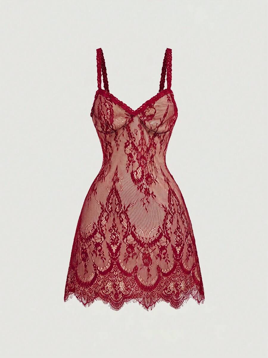 Women's short lace cami dress with spaghetti straps, contrast lace detailing, high waist, slim fit, and straight hem.