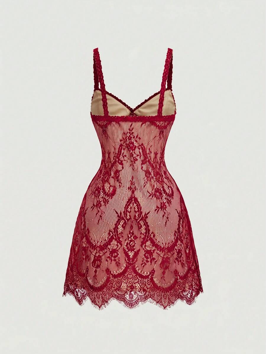 Women's short lace cami dress with spaghetti straps, contrast lace detailing, high waist, slim fit, and straight hem.