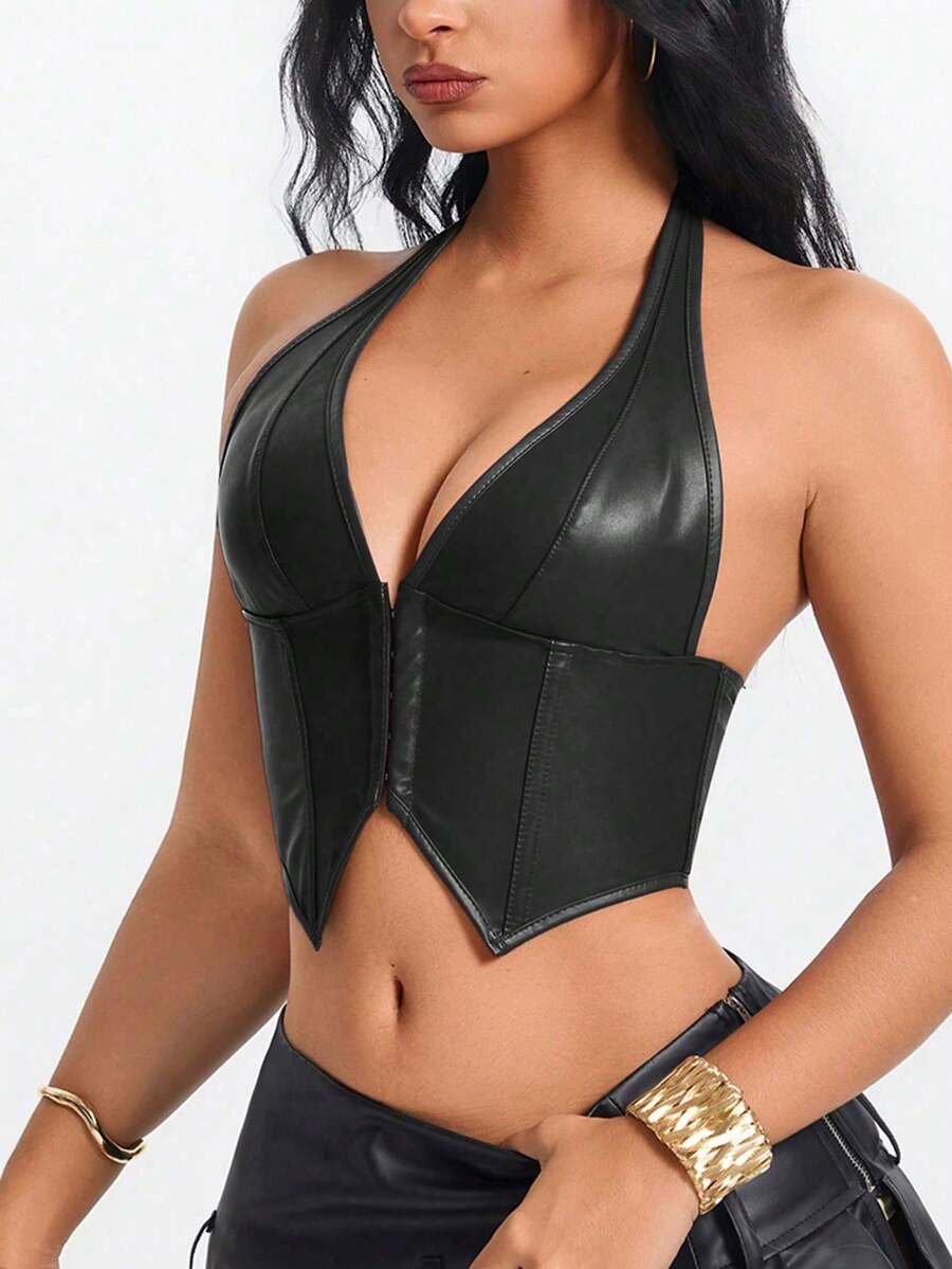 Retro PU halter tank top featuring a deep V-neck, grommet eyelet halter strap, tie back, boned details, and an asymmetrical hem.