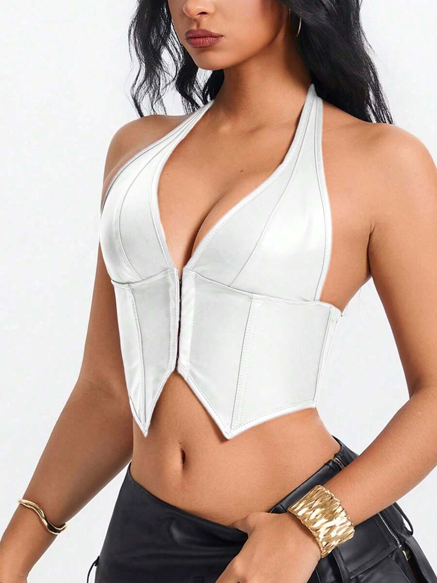 Retro PU halter tank top featuring a deep V-neck, grommet eyelet halter strap, tie back, boned details, and an asymmetrical hem.