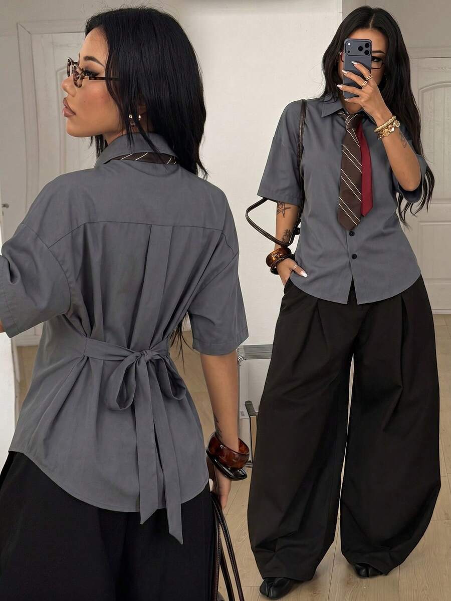 Women's casual button up shirt with half sleeves, classic shirt collar, and chest pocket in a woven fabric.