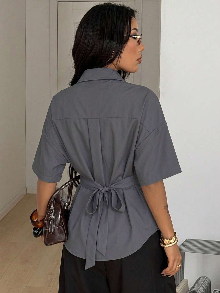 Women's casual button up shirt with half sleeves, classic shirt collar, and chest pocket in a woven fabric.