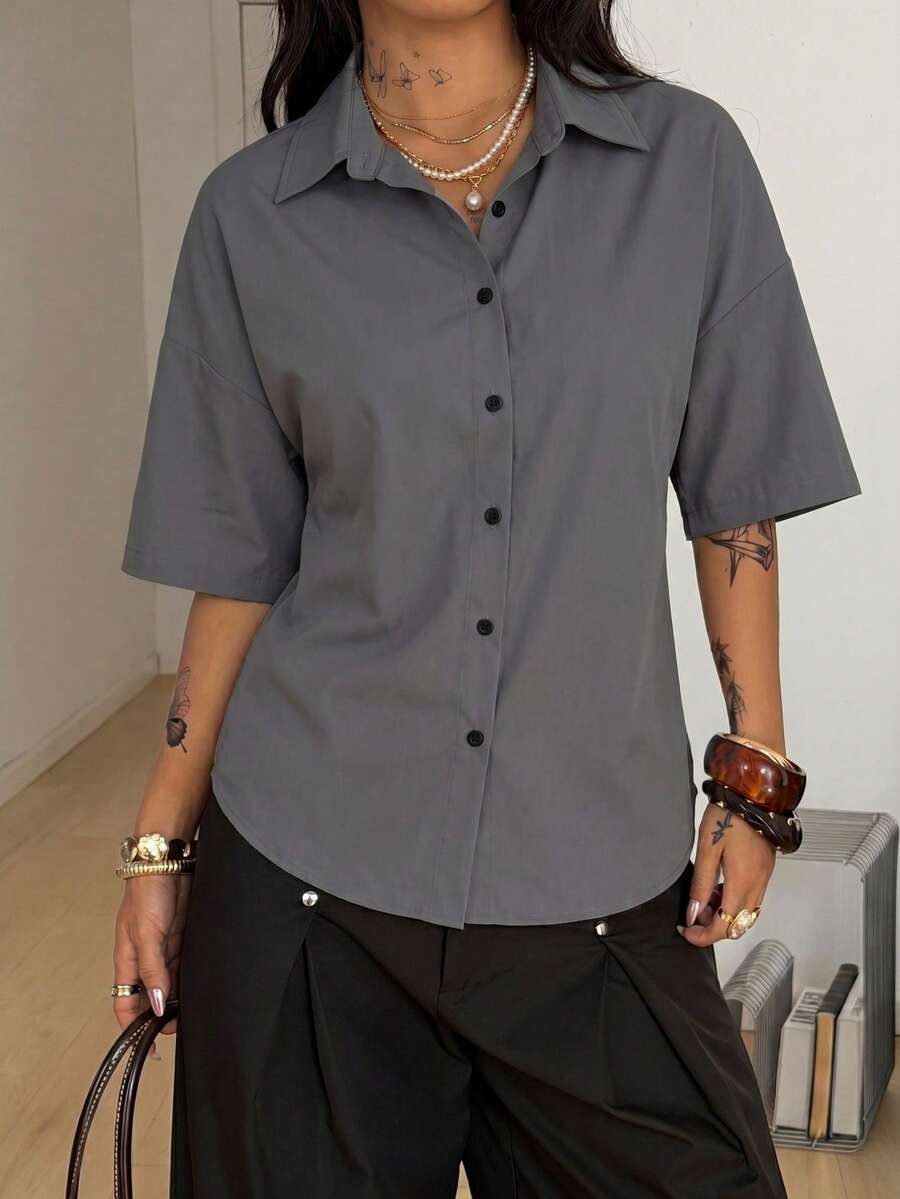 Women's casual button up shirt with half sleeves, classic shirt collar, and chest pocket in a woven fabric.