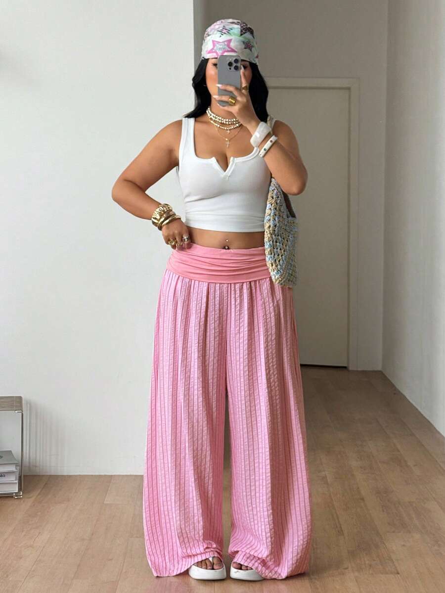 Women's plus size wide leg cotton pants featuring a relaxed loose fit and high waist design.