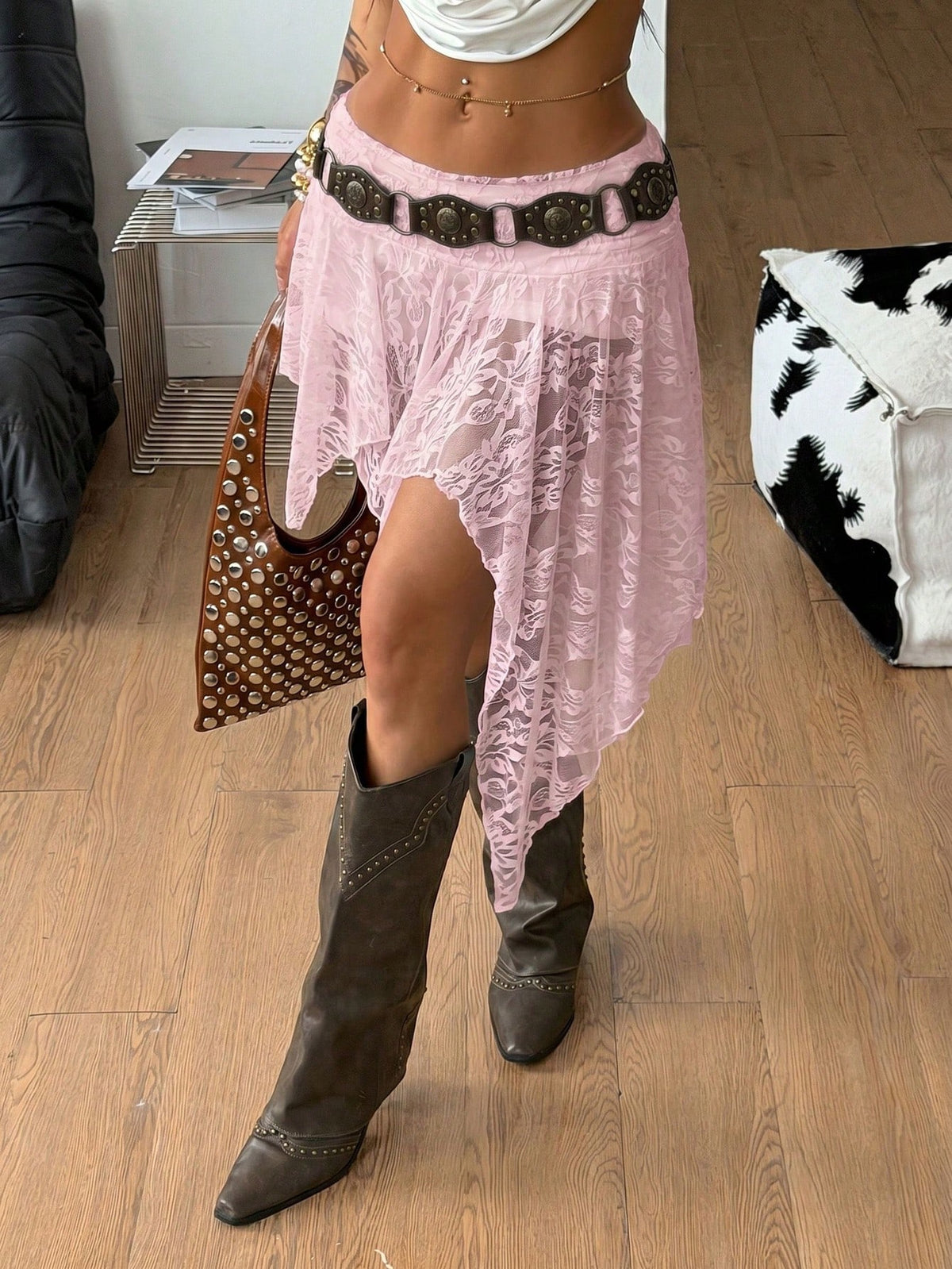 Women's floral lace mini skirt in white with asymmetrical ruffle trim and low waist design.