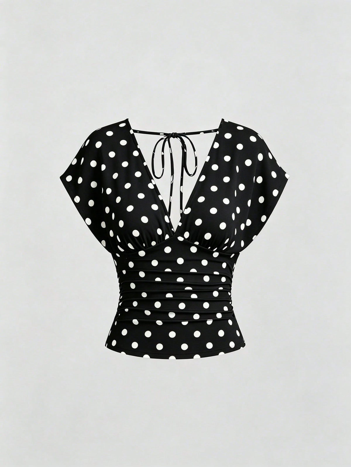 Women's black knitted t-shirt featuring a reversible deep v-neckline, batwing cap sleeves, ruched detailing, and a slim fit waist.