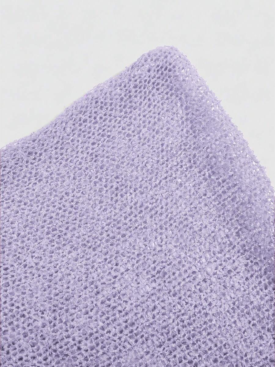 Women's casual hollow knit poncho top with boat neck, cloak sleeves, and asymmetrical hem