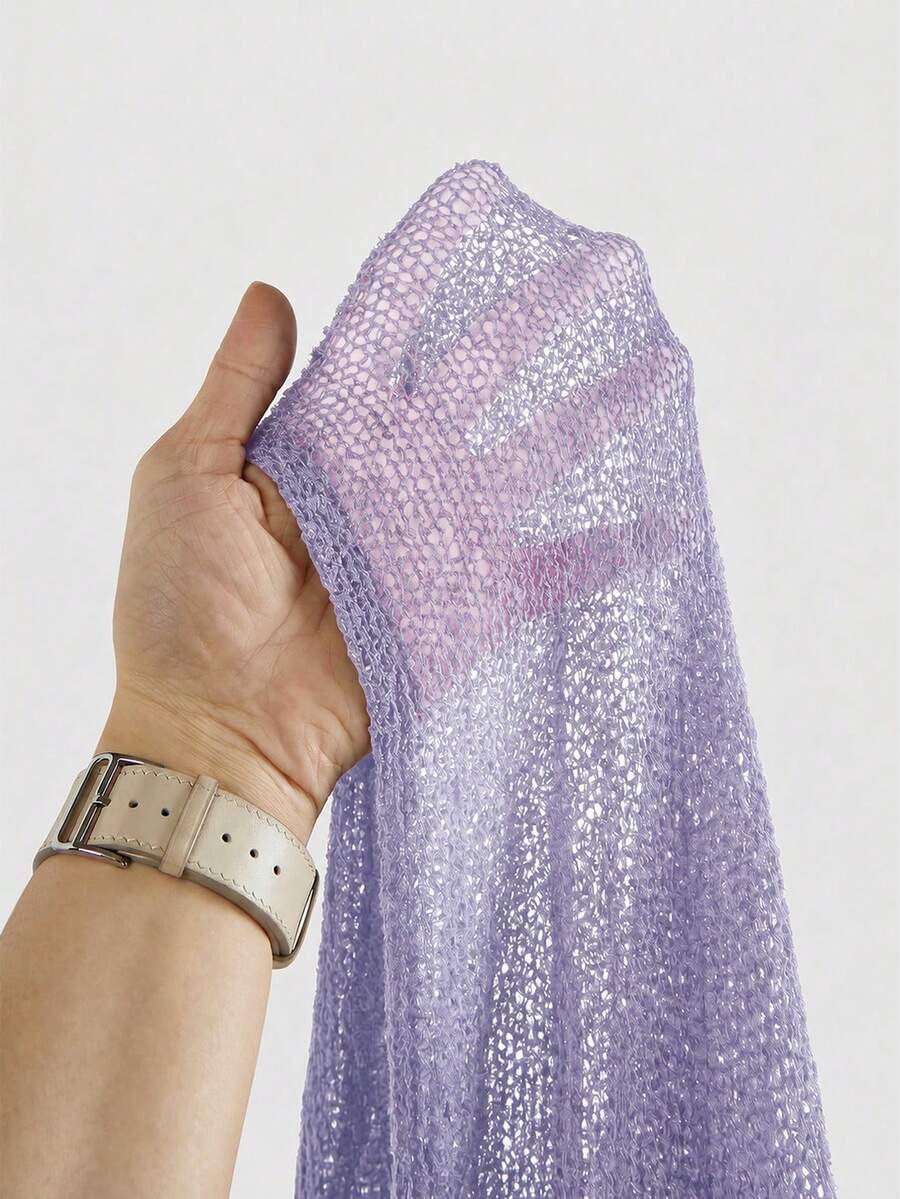 Women's casual hollow knit poncho top with boat neck, cloak sleeves, and asymmetrical hem