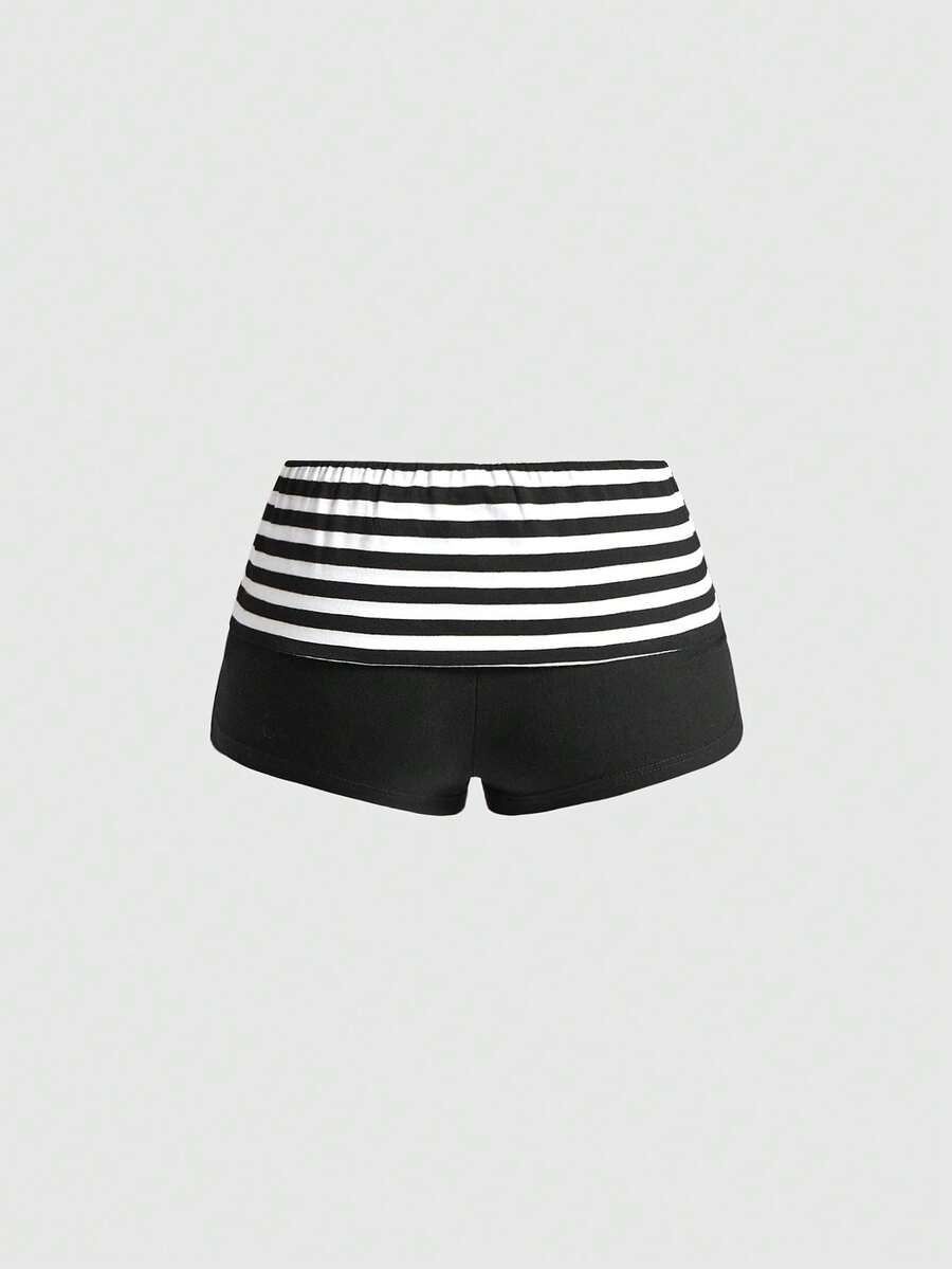 Women's ultra low waist mini shorts with folded waistband, striped letter print, and studded details in stretchy knitted fabric.