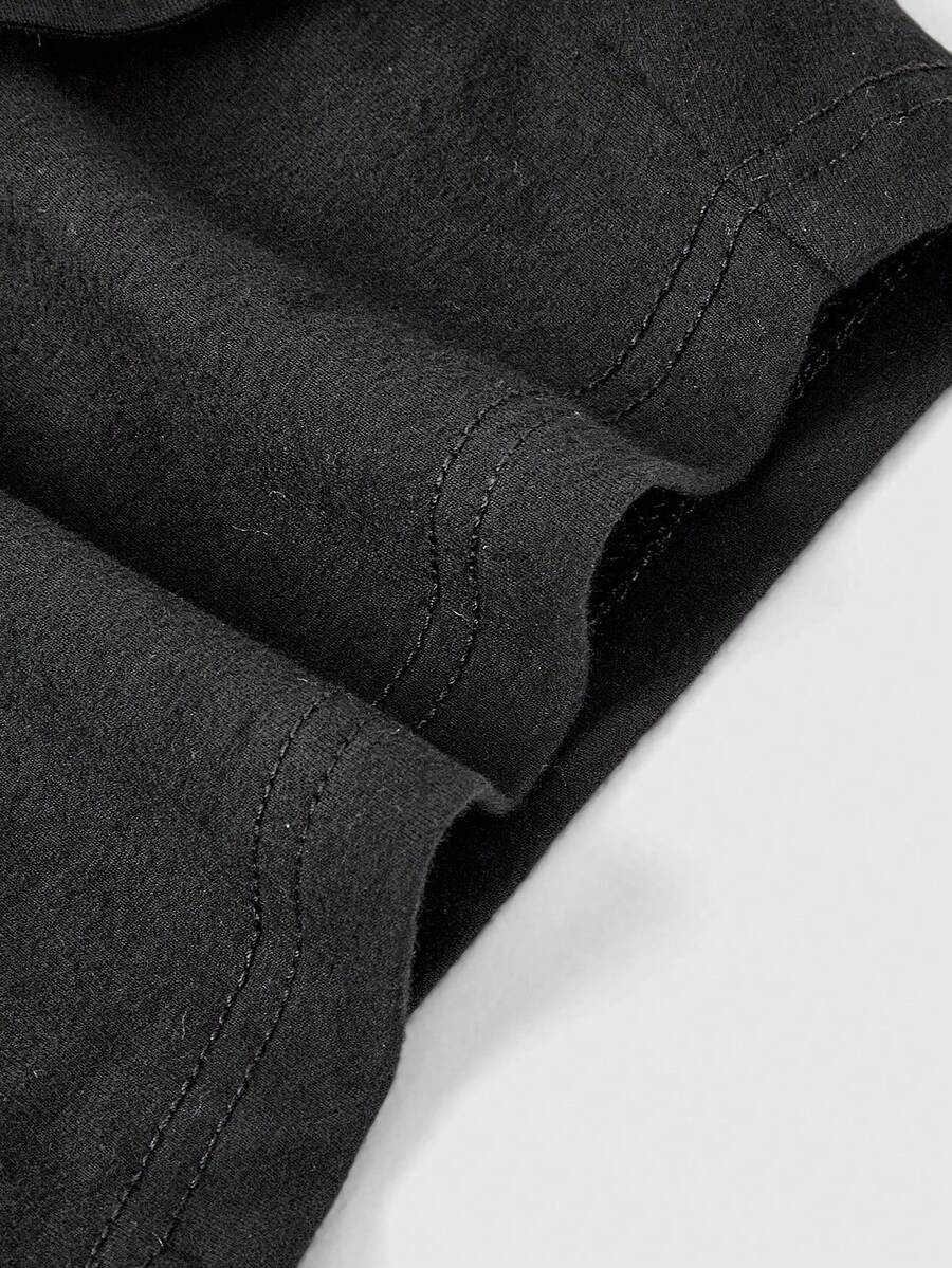 Women's ultra low waist mini shorts with folded waistband, striped letter print, and studded details in stretchy knitted fabric.