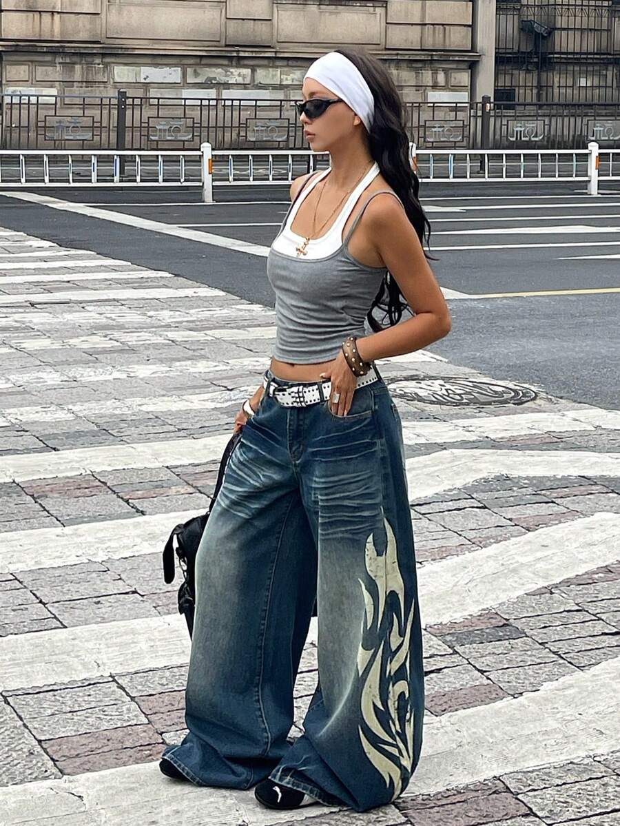 Women's loose wide-leg jeans in light wash denim with low waist and extra-long relaxed fit