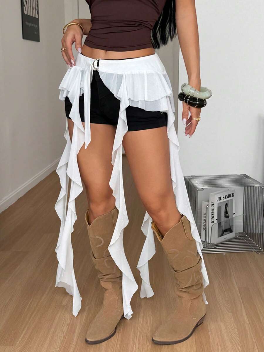 Women's black semi-sheer lace asymmetrical skirt with fringe details, contrast lace, low waist, and ruffle hem for beach, party, concert, or festival outfits.