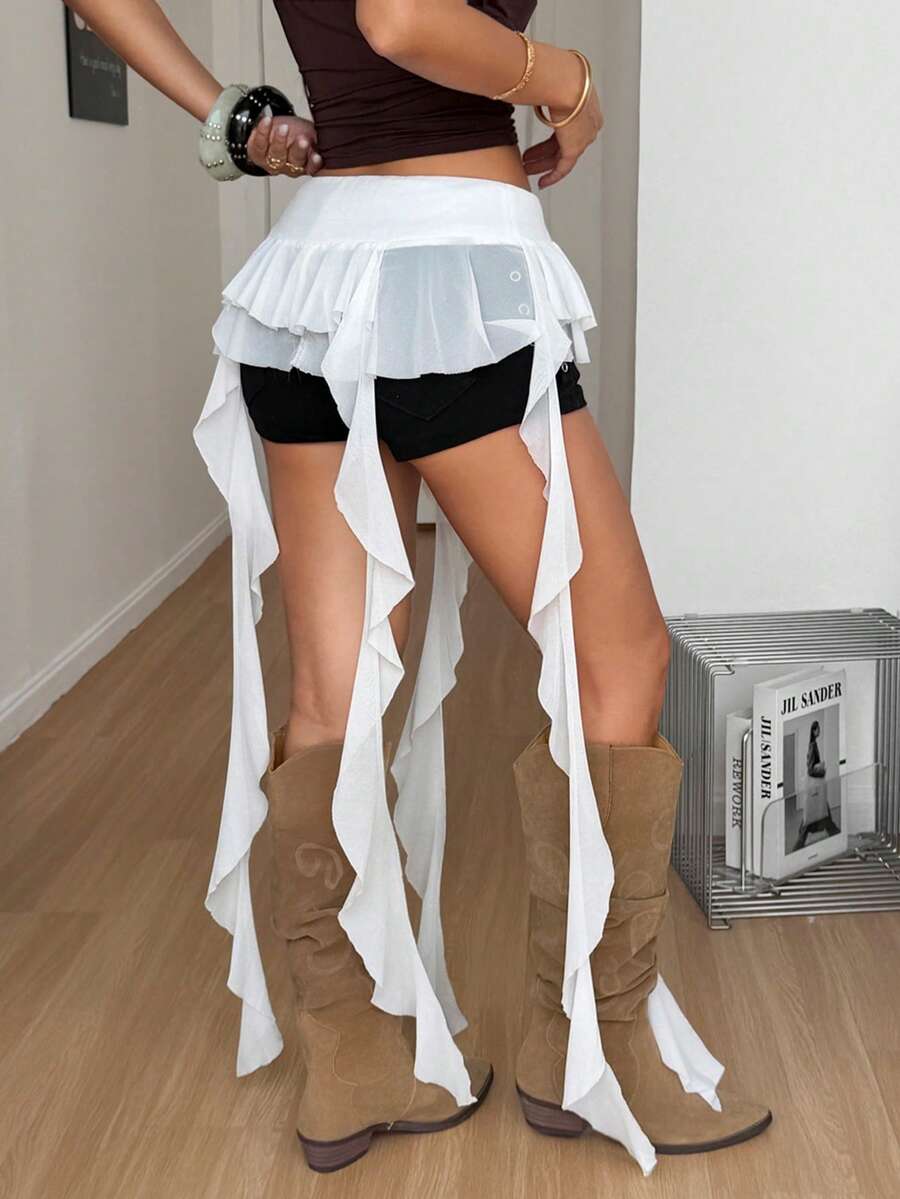 Women's black semi-sheer lace asymmetrical skirt with fringe details, contrast lace, low waist, and ruffle hem for beach, party, concert, or festival outfits.