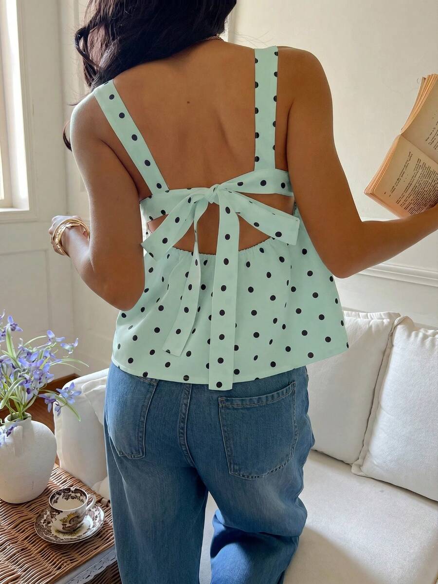 Women's casual polka dot tank top with tie-front knot, strap neckline, backless design, and ruffle flared hem