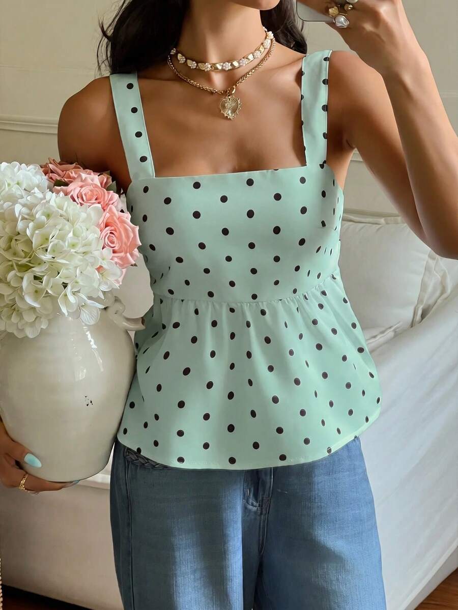 Women's casual polka dot tank top with tie-front knot, strap neckline, backless design, and ruffle flared hem