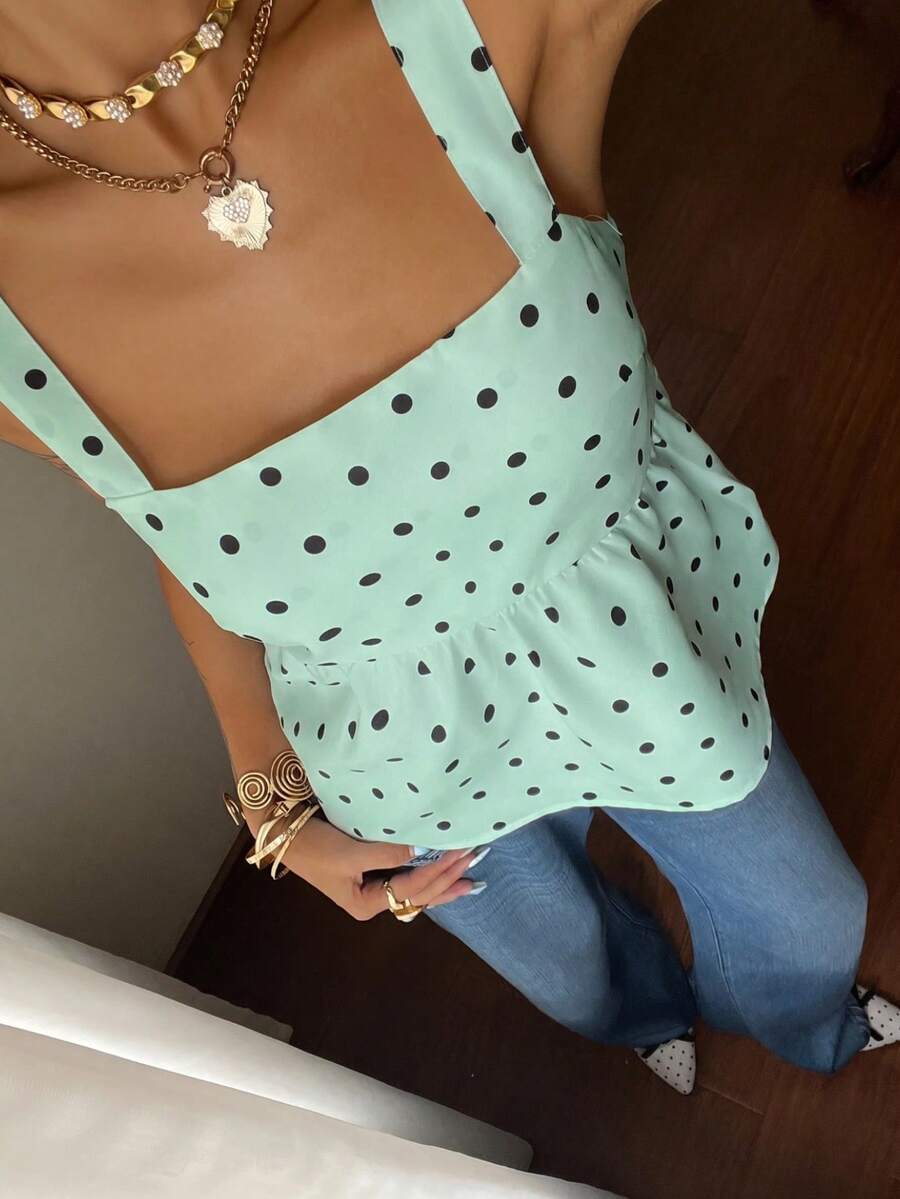 Women's casual polka dot tank top with tie-front knot, strap neckline, backless design, and ruffle flared hem