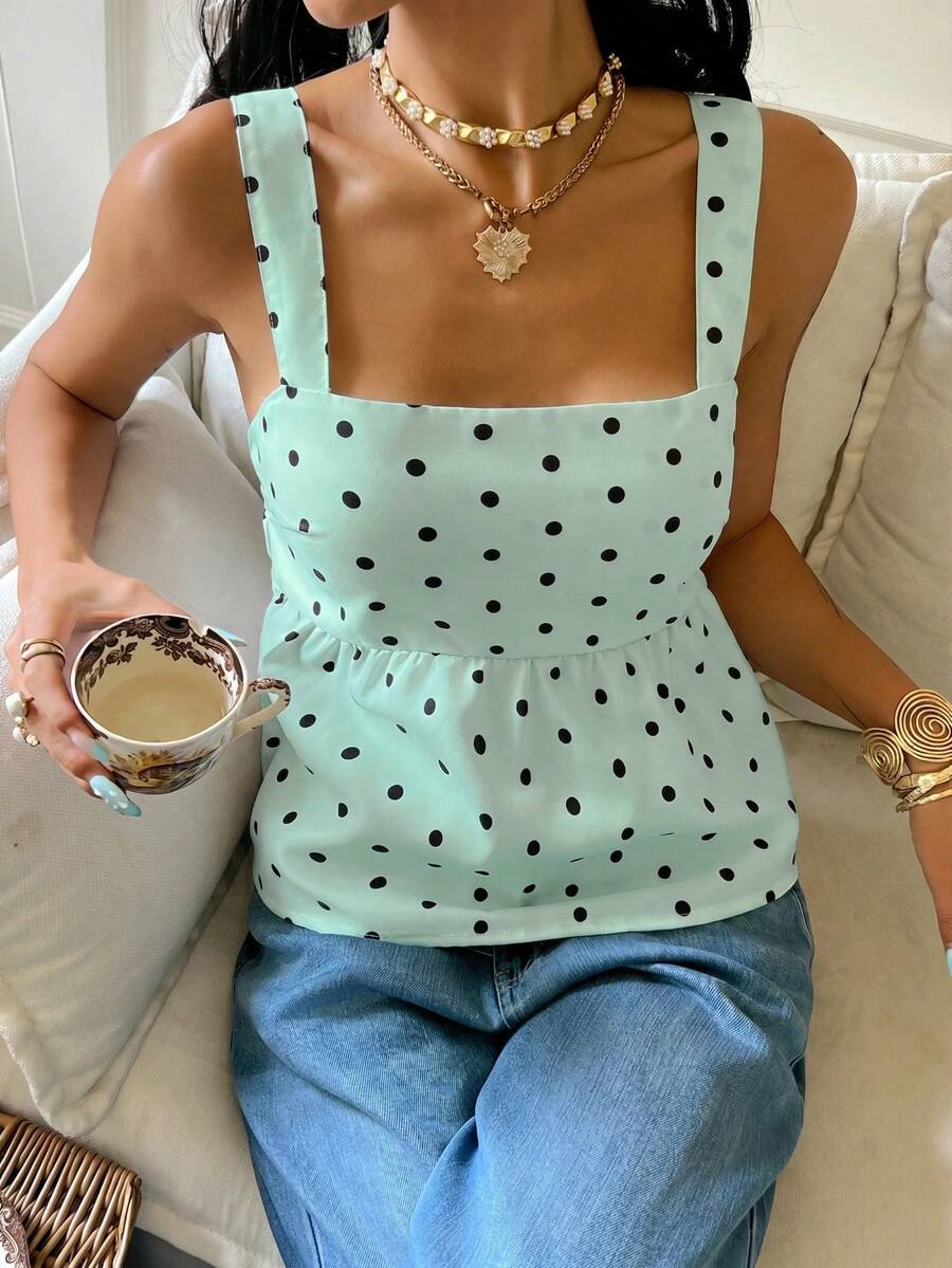 Women's casual polka dot tank top with tie-front knot, strap neckline, backless design, and ruffle flared hem