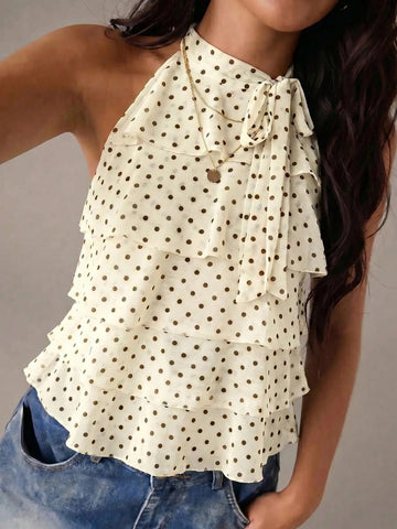 Women's sleeveless stand collar top in rib-knit fabric featuring button and hollow-out details.