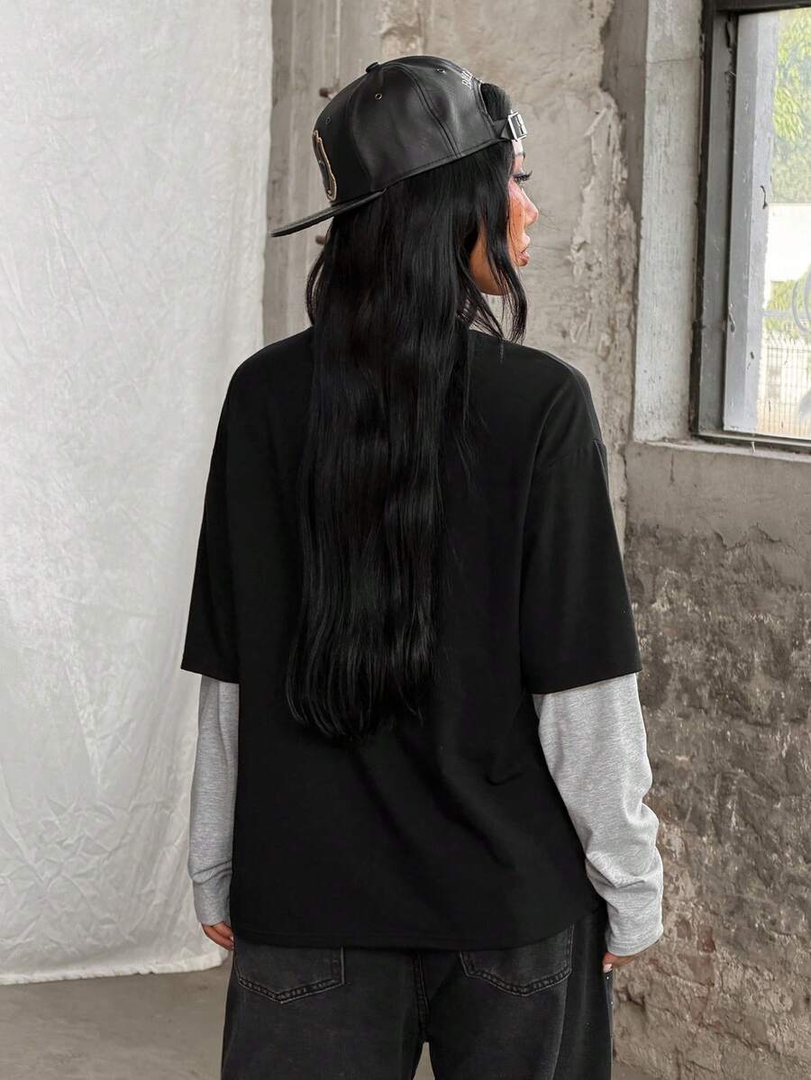 Women's casual graphic long sleeve t-shirt with a round neck, drop shoulder sleeves, and loose relaxed fit.